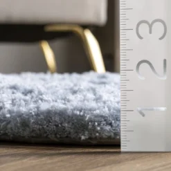 NuLOOM Hand Tufted Double Pelt Faux Sheepskin Area Rug, Shaped 2' X 6', Baby Blue -Baby Trend Store GUEST 8d5fb5af a073 4d4e ac01 4f94d3ed9aab